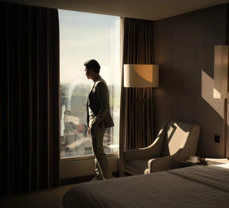 a man standing in a hotel room